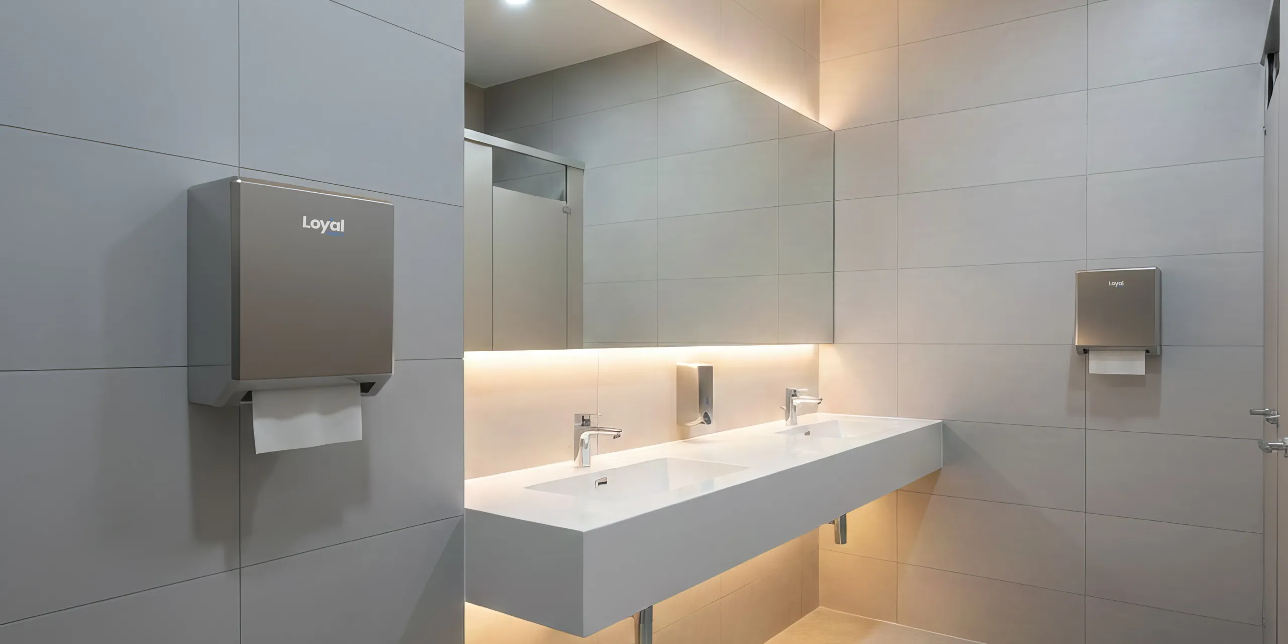 Modern commercial restroom with Loyal-branded dispensers